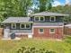 The home features a large backyard, with a combination of brick and gray siding at 2904 Falkirk Pl, Raleigh, NC 27604