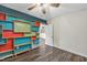 Charming bedroom featuring a unique shelving unit and wood-look laminate flooring at 2904 Falkirk Pl, Raleigh, NC 27604