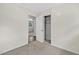 Bedroom with carpet, closet, neutral color scheme, and a view to another room at 2904 Falkirk Pl, Raleigh, NC 27604