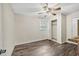 Cozy bedroom with closet, window, ceiling fan, and wood-look laminate flooring at 2904 Falkirk Pl, Raleigh, NC 27604