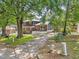 Charming two-story home with a well-maintained front yard and mature trees at 2904 Falkirk Pl, Raleigh, NC 27604