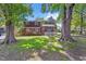 Charming two-story home with mature trees, a covered porch, and beautiful landscaping at 2904 Falkirk Pl, Raleigh, NC 27604