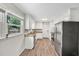 Bright kitchen featuring stainless steel appliances, granite countertops, and white cabinets at 2904 Falkirk Pl, Raleigh, NC 27604