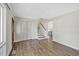 Inviting living room with wood-look laminate flooring and staircase at 2904 Falkirk Pl, Raleigh, NC 27604