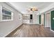Bright living room with wood-look floors, ceiling fan, and natural light at 2904 Falkirk Pl, Raleigh, NC 27604
