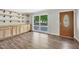 Bright room features wood floors, custom shelving, and a large window overlooking the front yard at 2904 Falkirk Pl, Raleigh, NC 27604