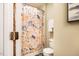 Bathroom featuring shower with decorative floral shower curtain, with neutral walls at 3 Little Stone Cir, Durham, NC 27703