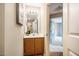 Bathroom featuring updated vanity, lighting, with view into bedroom at 3 Little Stone Cir, Durham, NC 27703