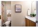 Bathroom with decorative shower curtain, white towels, and updated flooring at 3 Little Stone Cir, Durham, NC 27703