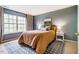 Comfortable bedroom with neutral walls, large window, and plush bedding at 3 Little Stone Cir, Durham, NC 27703