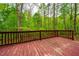 Exterior shot of a stained deck that is perfect for entertaining at 3 Little Stone Cir, Durham, NC 27703