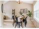 Bright dining room featuring a modern chandelier, and an open layout with carpet flooring at 3 Little Stone Cir, Durham, NC 27703