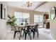 Bright dining room featuring a modern chandelier, natural light, and an open layout with a sliding glass door at 3 Little Stone Cir, Durham, NC 27703