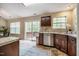 Traditional kitchen with stainless steel dishwasher, granite countertops, and sliding door to the backyard deck at 3 Little Stone Cir, Durham, NC 27703