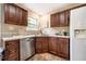 Well-equipped kitchen featuring stainless steel appliances, dark wood cabinets, and durable countertops at 3 Little Stone Cir, Durham, NC 27703