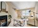 Bright living room featuring a cozy fireplace, modern decor, and an open layout with carpet flooring at 3 Little Stone Cir, Durham, NC 27703