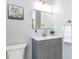 Bathroom showcasing a modern vanity, mirror, and decorative wall art at 301 Trappers Sack Rd, Cary, NC 27513