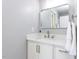 Bathroom featuring updated white vanity, silver hardware, and a modern mirror at 301 Trappers Sack Rd, Cary, NC 27513