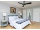 Cozy bedroom includes hardwood floors, neutral walls, and an ensuite bath at 301 Trappers Sack Rd, Cary, NC 27513