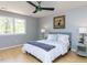 Bedroom featuring natural light, a ceiling fan, and stylish decor at 301 Trappers Sack Rd, Cary, NC 27513
