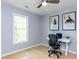 Bedroom featuring natural light, modern artwork, and a dedicated workspace at 301 Trappers Sack Rd, Cary, NC 27513