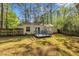 Backyard with blue deck, fence, and home featuring sliding glass doors at 3116 Henslowe Dr, Raleigh, NC 27603
