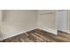 Bright bedroom featuring neutral paint, new hardwood floors and a closet at 3116 Henslowe Dr, Raleigh, NC 27603