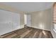 Bedroom with wood floors, neutral walls, double closet and bright window at 3116 Henslowe Dr, Raleigh, NC 27603