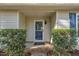 Welcoming front porch with a storm door, neat landscaping, and house number display at 3116 Henslowe Dr, Raleigh, NC 27603