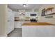 Bright kitchen with white cabinets, modern appliances, and a butcher block island at 3116 Henslowe Dr, Raleigh, NC 27603
