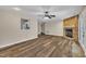 Inviting living room with stone fireplace, hardwood floors, and abundant natural light at 3116 Henslowe Dr, Raleigh, NC 27603
