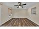 Spacious living room with hardwood floors, ceiling fan, and natural light from the window at 3116 Henslowe Dr, Raleigh, NC 27603