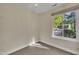 Inviting room featuring neutral paint, tile flooring and a large bright window at 3116 Henslowe Dr, Raleigh, NC 27603
