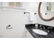 Bathroom featuring a granite countertop and round mirror at 3117 Woodgreen Dr, Raleigh, NC 27607