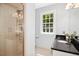 Bathroom featuring a glass-enclosed shower and granite countertop at 3117 Woodgreen Dr, Raleigh, NC 27607