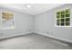 Bedroom featuring neutral walls and carpet, and bright windows at 3117 Woodgreen Dr, Raleigh, NC 27607