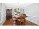 Dining room with hardwood floors, wood table, and china cabinet at 3117 Woodgreen Dr, Raleigh, NC 27607