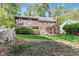 Brick home with lush backyard and manicured landscaping at 3117 Woodgreen Dr, Raleigh, NC 27607