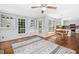 Open kitchen and dining area with hardwood floors, natural light, and white cabinetry at 3117 Woodgreen Dr, Raleigh, NC 27607