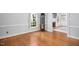 Hardwood floors in a cozy living room featuring a fireplace at 3117 Woodgreen Dr, Raleigh, NC 27607