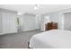 Spacious main bedroom with two windows, carpet, ensuite, and large closets at 3117 Woodgreen Dr, Raleigh, NC 27607