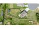 Aerial shot displays a house with a large fenced backyard and patio at 312 Loon Ct, Graham, NC 27253