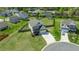Beautiful aerial view of a home with a long driveway and well-manicured lawn at 312 Loon Ct, Graham, NC 27253