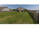 Spacious fenced backyard with a patio and screened porch at 312 Loon Ct, Graham, NC 27253