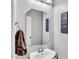 Neat bathroom with a modern mirror and gray walls at 312 Loon Ct, Graham, NC 27253