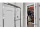 Bathroom featuring a clear glass shower and an entrance to the walk-in closet at 312 Loon Ct, Graham, NC 27253