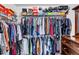 Walk-in closet featuring ample clothing storage and an organized shoe rack at 312 Loon Ct, Graham, NC 27253