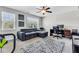 Home office with large sectional couch, a desk, computer and natural light at 312 Loon Ct, Graham, NC 27253