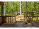Backyard view from the wood porch showcasing a spacious yard, shed, and lush greenery at 3312 Shannon Cir, Apex, NC 27539