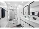 Updated bathroom with black framed mirrors, double sink vanity, and a walk-in shower at 3312 Shannon Cir, Apex, NC 27539